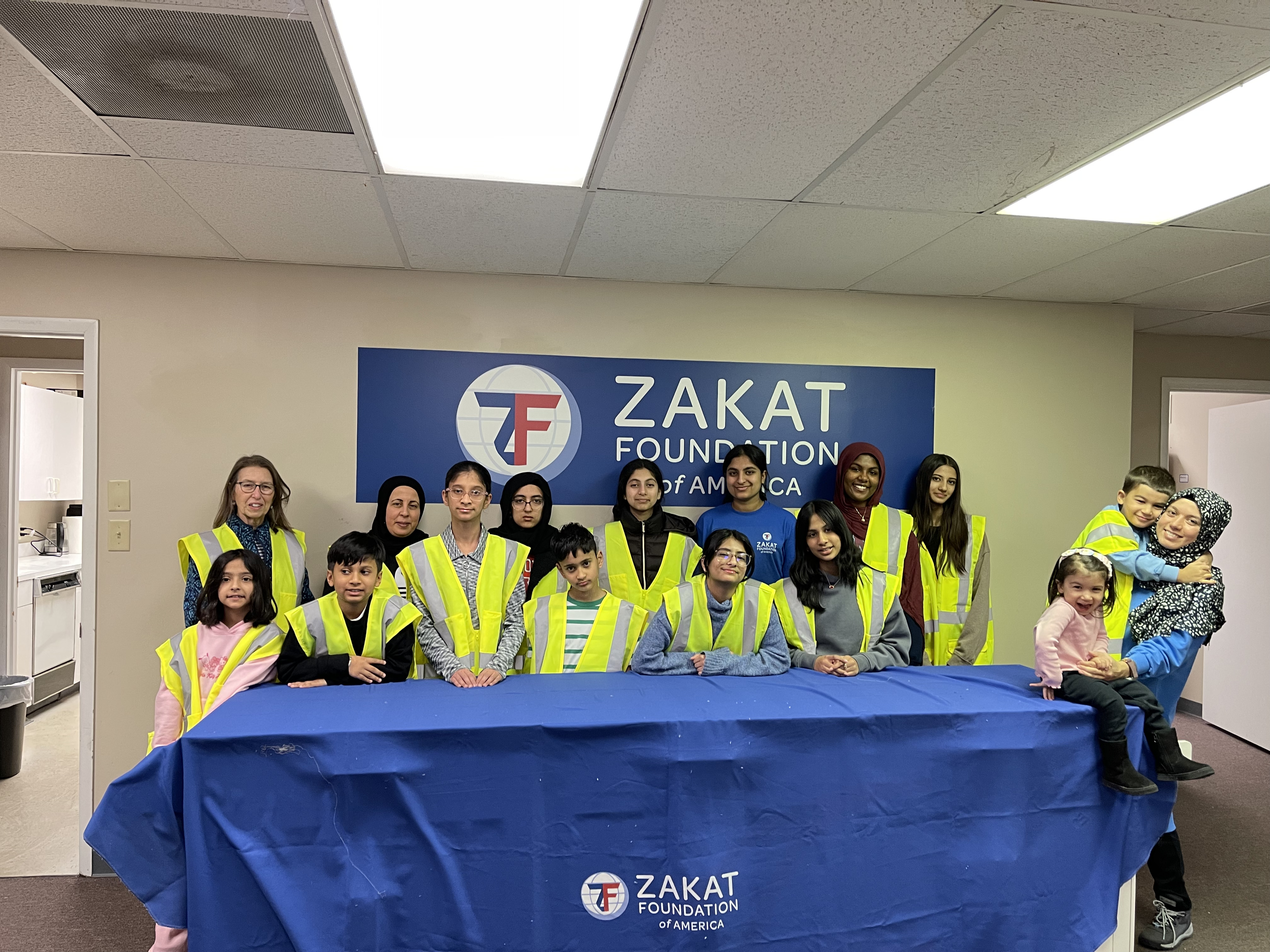 Youth volunteers in Delaware line up to pack hygiene kits